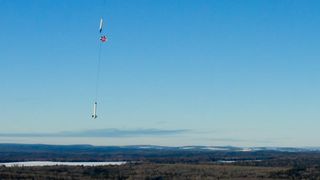 The Stardust 1.0 rocket floats back to Earth under its main parachute after a successful first low-altitude launch test from Loring Commerce Center in Limestone, Maine on Jan. 31, 2021.