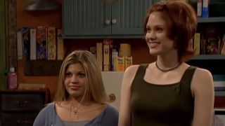 Danielle Fishel and Maitland Ward standing in the Boy Meets World set of Rachel, Eric and Jack's apartment