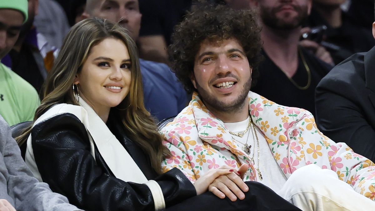 Selena Gomez and Benny Blanco smiling at a Laker&#039;s Game in 2024