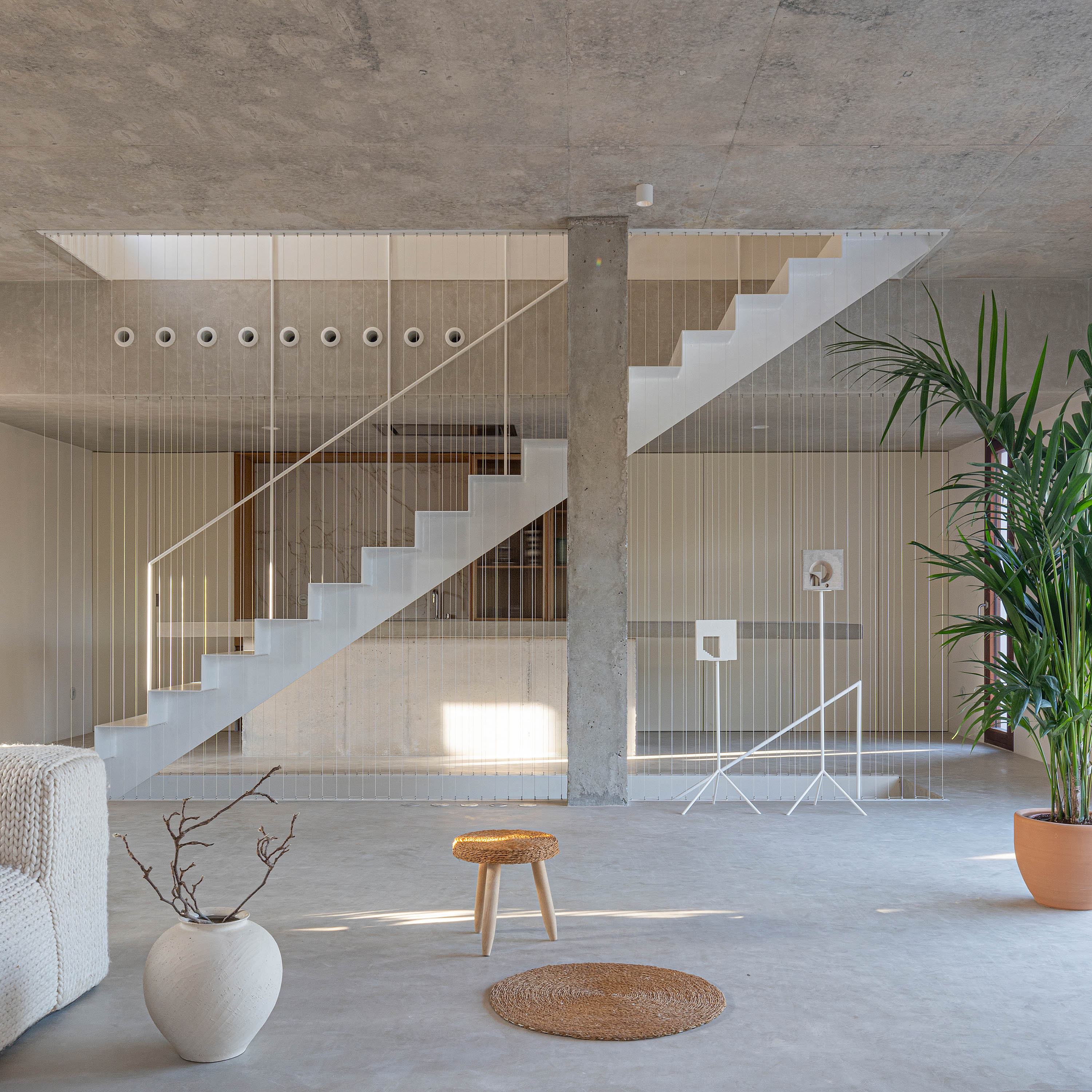 Formentera House by Mari&amp;agrave; Castell&amp;oacute;, a white concrete structure in the countryside