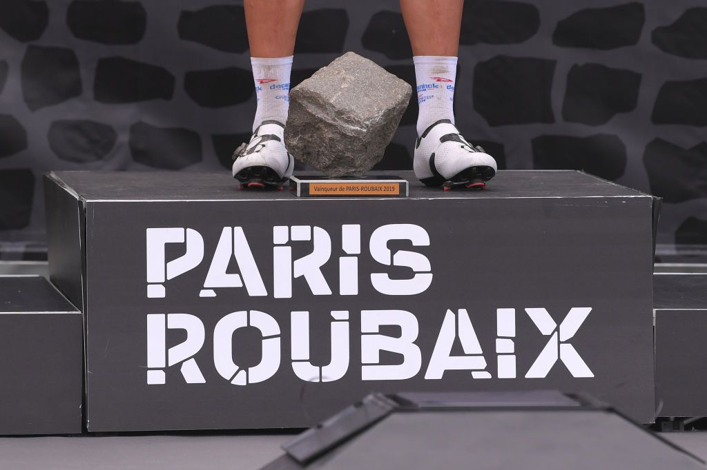 ROUBAIX FRANCE APRIL 14 Podium Philippe Gilbert of Belgium and Team DeceuninckQuickStep Celebration Trophy Cobblestone Detail view during the 117th ParisRoubaix a 257km race from Compigne to Roubaix ParisRoubaix ParisRoubaix PRBX LEnfer du Nord on April 14 2019 in Roubaix France Photo by Luc ClaessenGetty Images