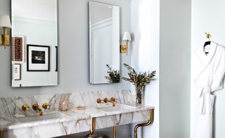 Bathrooms feature refined marble, nodding to the building's heritage