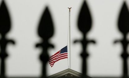 As global media outlets weigh in on Gabrielle Gifford's heroism and gun reform, flags fly at half mast in the U.S. capital. 