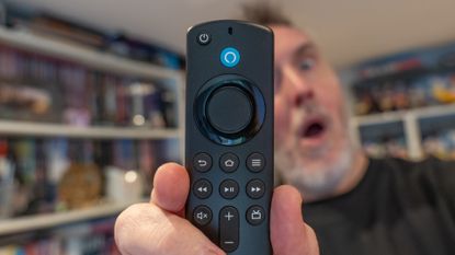 Rik Henderson looks on in shock at an Amazon Fire TV Stick 4K remote control