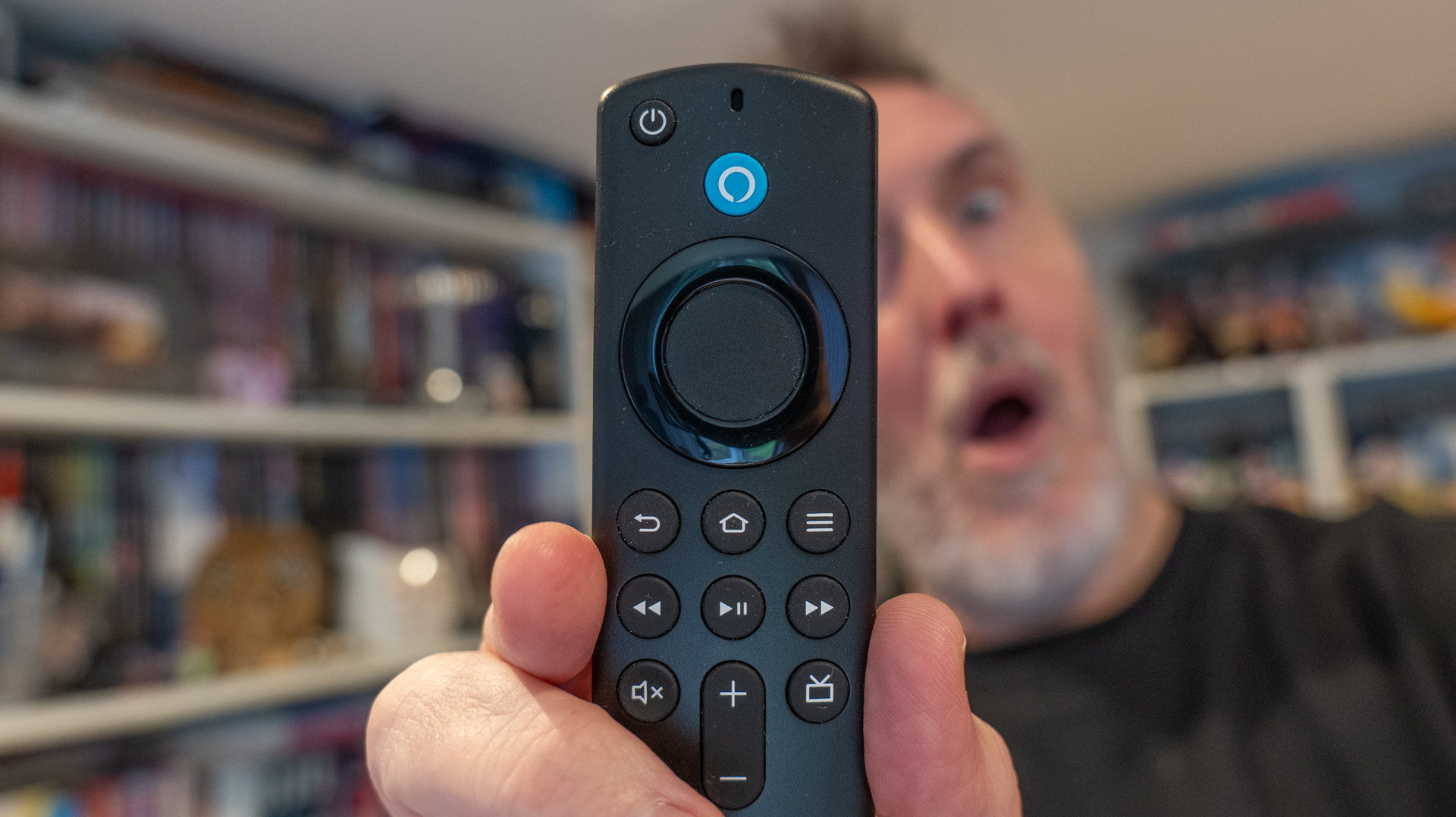 Rik Henderson looks on in shock at an Amazon Fire TV Stick 4K remote control