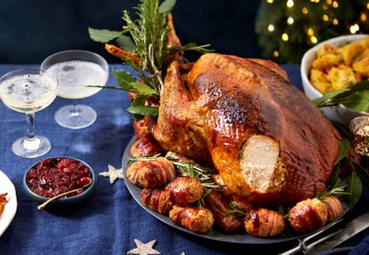 Turkey with herby butter and fruity stuffing balls