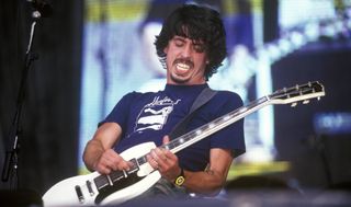 Dave Grohl performs onstage with the Foo Fighters in 1998