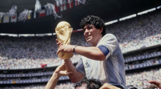 Diego Maradona holds the World Cup trophy after Argentina defeated West Germany 3-2 in the 1986 World Cup final at the Estadio Azteca, Mexico City on 29 June, 1986.