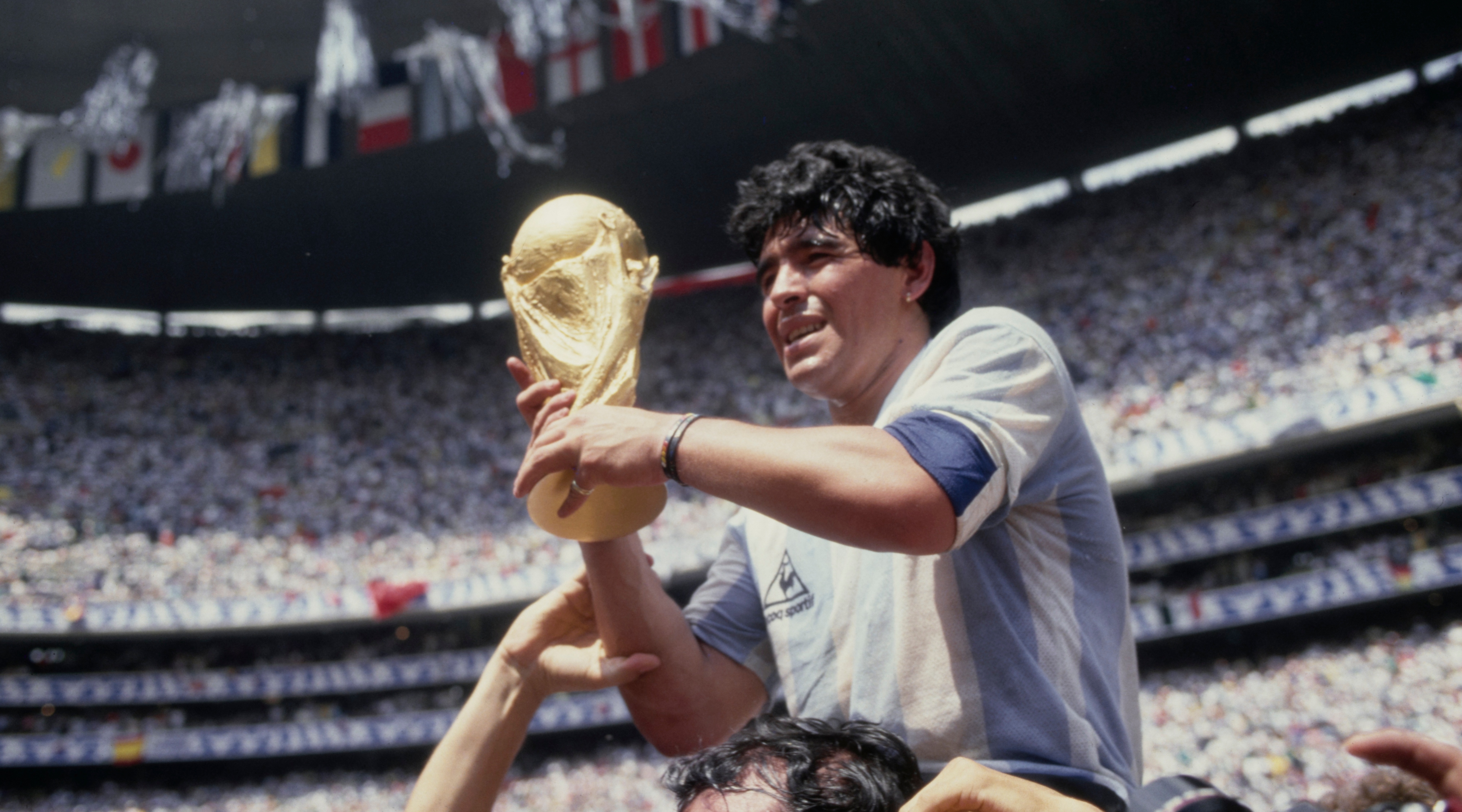 Diego Maradona holds the World Cup trophy after Argentina defeated West Germany 3-2 in the 1986 World Cup final at the Azteca Stadium, Mexico City on June 29, 1986.