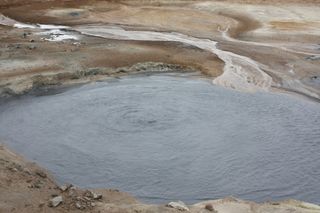 A bubbling hydrothermal pool in the Mývatn area of Iceland. Could such pools have promoted phosphorus-oxygen bonds on the surfaces of schreibersite meteorites that had fallen into the pools?