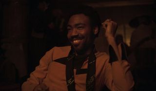 Solo: A Star Wars Story Lando smiling in the middle of a card game