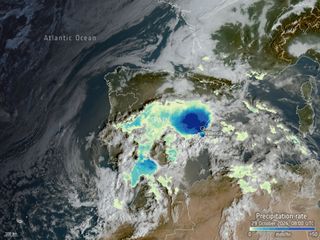 Aerial view with overlayed map from a high altitude, with clouds and rainfall radar shown.