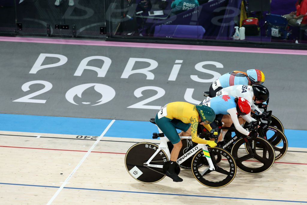 PARIS FRANCE AUGUST 11 LR Georgia Baker of Team Australia Maggie ColesLyster of Team Canada winner Jennifer Valente of Team United States and Lotte Kopecky of Team Belgium sprint at finish line during the Womens Omnium Elimination Race 34 on day sixteen of the Olympic Games Paris 2024 at SaintQuentinenYvelines Velodrome on August 11 2024 in Paris France Photo by Alex BroadwayGetty Images