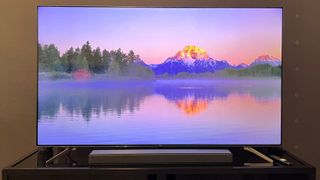TCL Q7 TV showing colorful landscape onscreen
