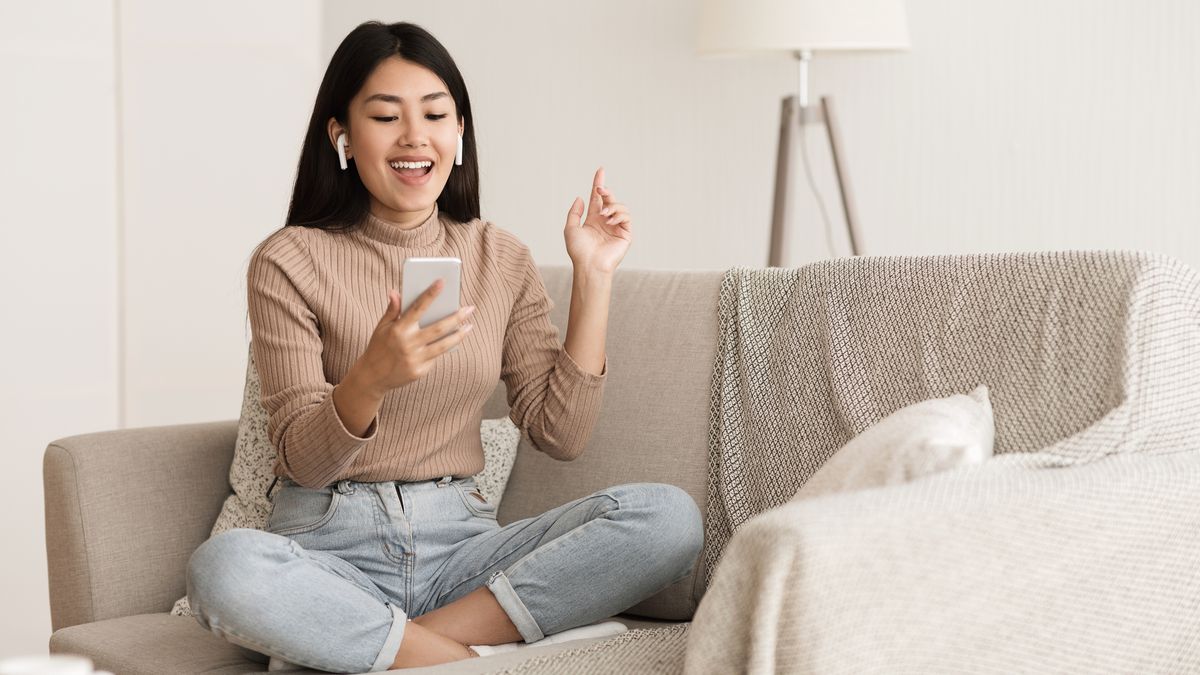 a woman using a pair of airpods