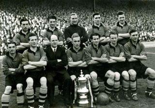 The Wolves team who won the 1948/49 FA Cup with the trophy