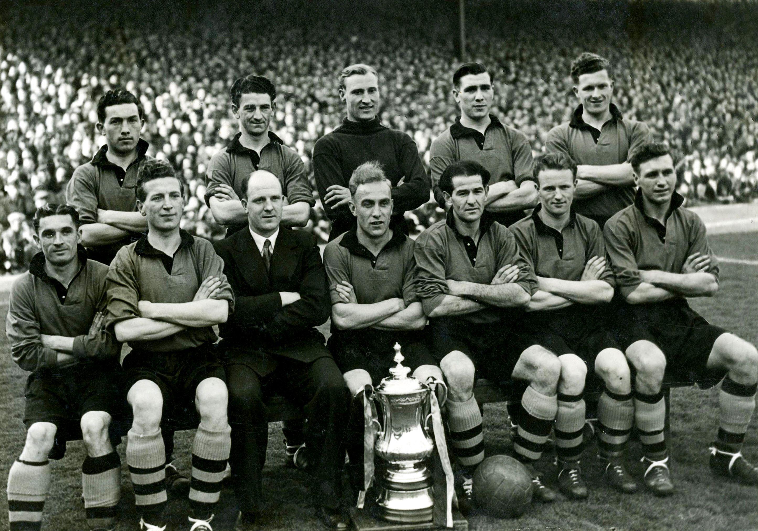 The Wolves team who won the 1948/49 FA Cup with the trophy