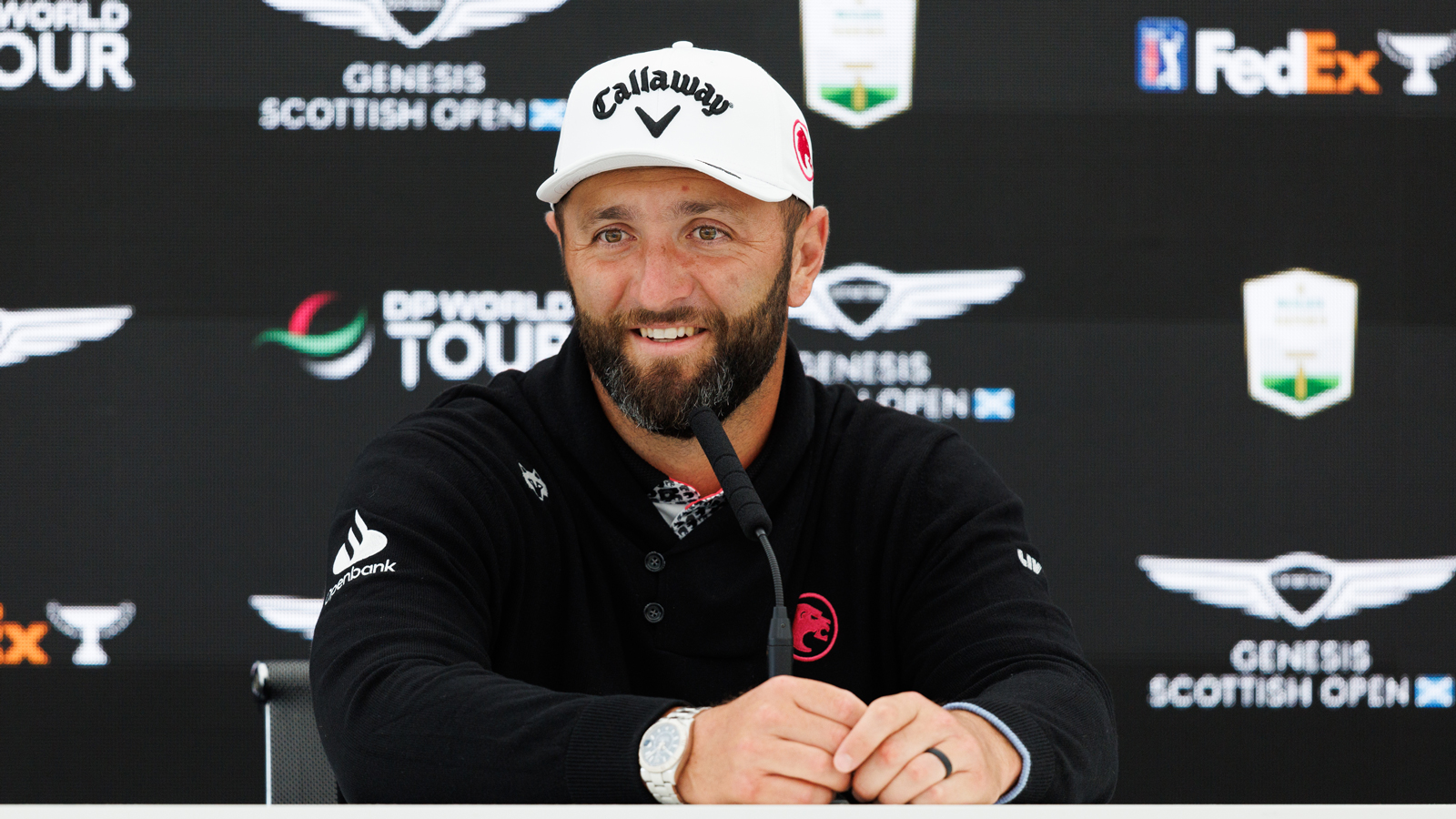 Jon Rahm speaks at a press conference