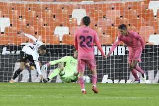 Raphael Varane, right, scored an own-goal in Real Madrid's defeat at Valencia