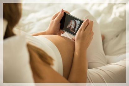 pregnancy ultrasound: a woman looks at her 3d baby scan 