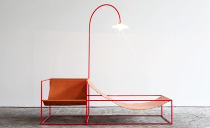 Red chair with a red hanging lamp