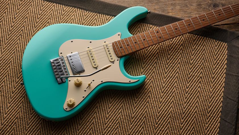 A Cort G200SE electric guitar lying on a rug