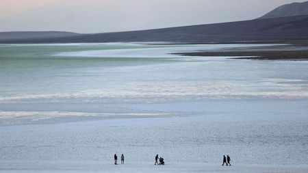 People visiting a lake at Death Valley