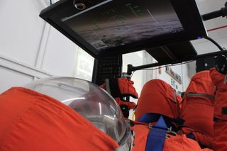 Final Frontier Design's third-generation spacesuit in a flight simulator.