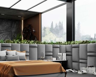modern mountain style bedroom with large windows with forest in the background, and gray headboard