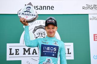 Ethan Hayter of Ineos Grenadiers dons the turquoise leader jersey after prologue victory