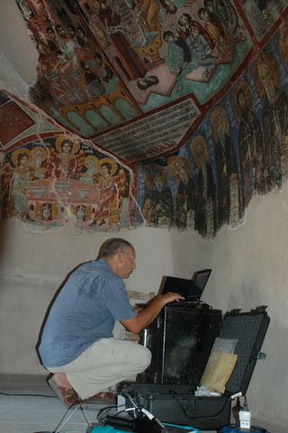 studying 12th-century paintings in a byzantine monastery,