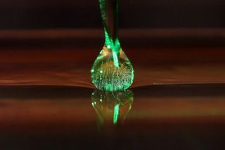 A camera captures a drop of oil levitating during an experiment at MIT.