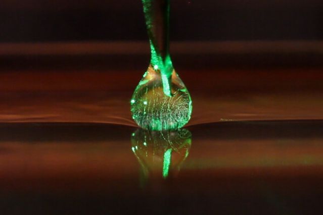 A camera captures a drop of oil levitating during an experiment at MIT.