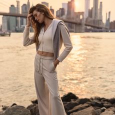 model wearing Vuori loungewear set in cream