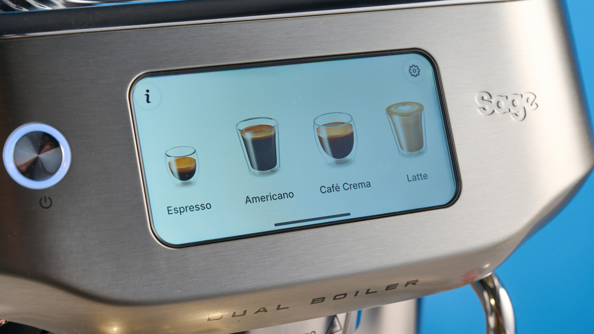 the breville oracle dual boiler / sage oracle dual boiler in stainless steel, showing its touchscreen, steam wand, built in grinder, and espresso shots