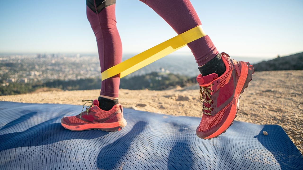 Person using a resistance band to do leg exercise 