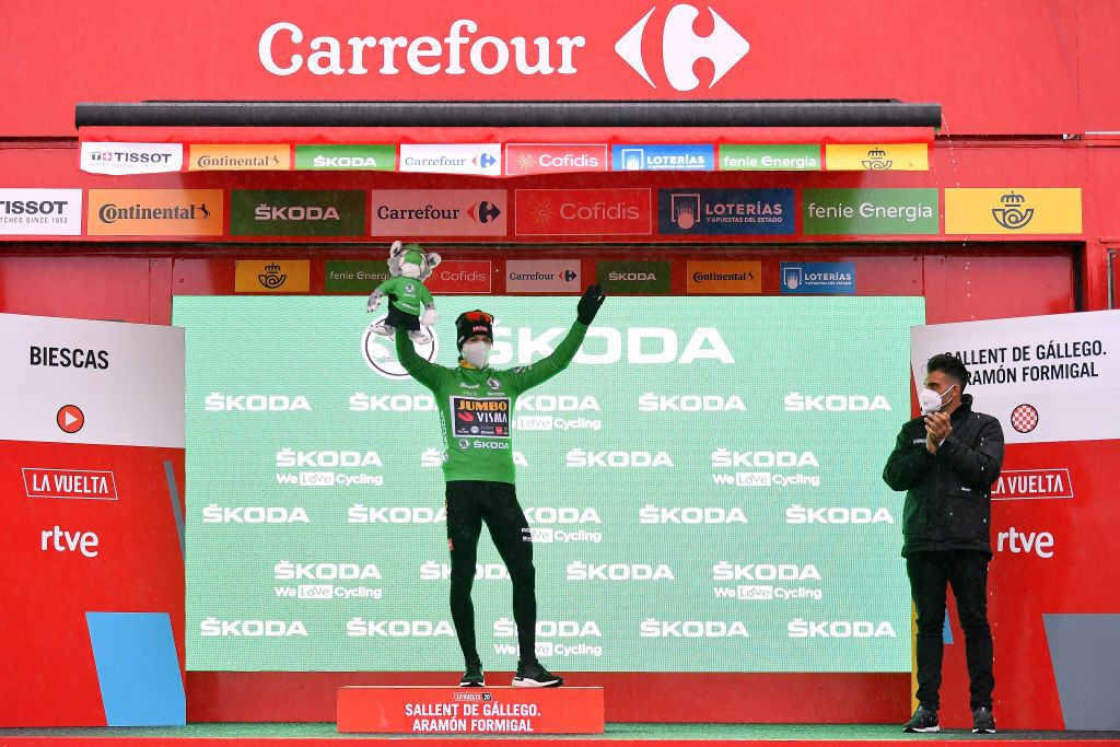 SALLENT DE GLLEGO SPAIN OCTOBER 25 Podium Primoz Roglic of Slovenia and Team Jumbo Visma Green Points Jersey Celebration Oscar Pereiro of Spain Ex Procyclist winner of the Tour of France 2006 Mask Covid safety measures Mascot during the 75th Tour of Spain 2020 Stage 6 a 1464km stage from Biescas to Sallent de Gllego Aramn Formigal 1790m lavuelta LaVuelta20 La Vuelta on October 25 2020 in Sallent de Gllego Spain Photo by Justin SetterfieldGetty Images