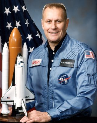 Astronaut Robert Overmyer poses for an official NASA portrait.