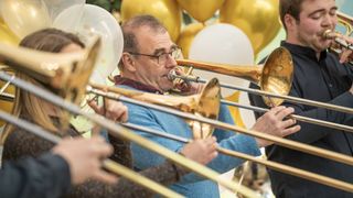 Jürgen plays the trombone alongside members of Bone-Afide in The Great British Bake Off.