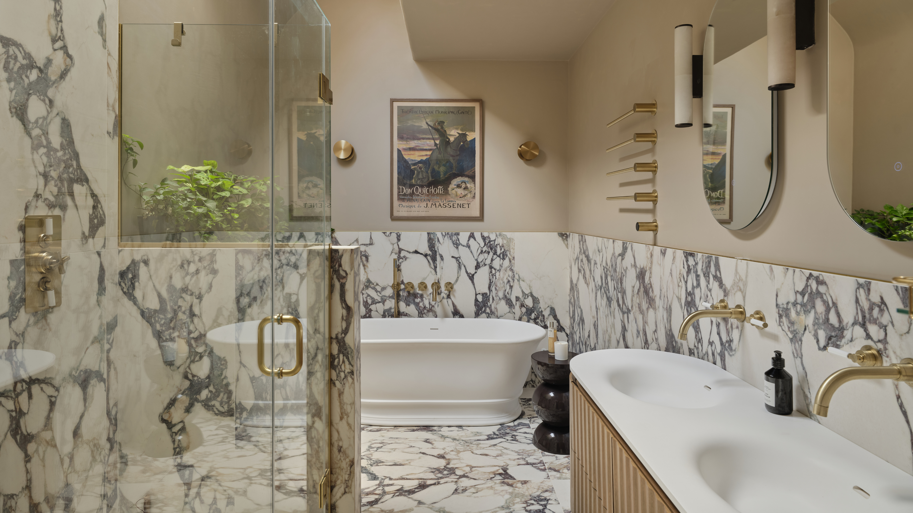 marble clad bathroom design with freestanding bath and double sink