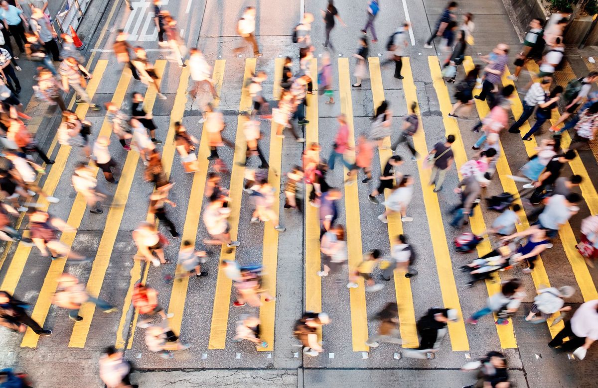 A busy pedestrian street crossing.