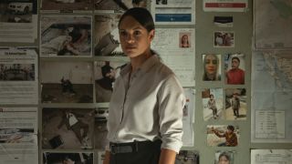 Cynthia Addai-Robinson next to a wall of evidence in The Accountant 2