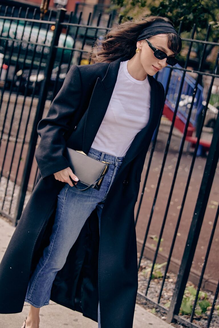 a woman wearing blue straight-leg denim at new york fashion week