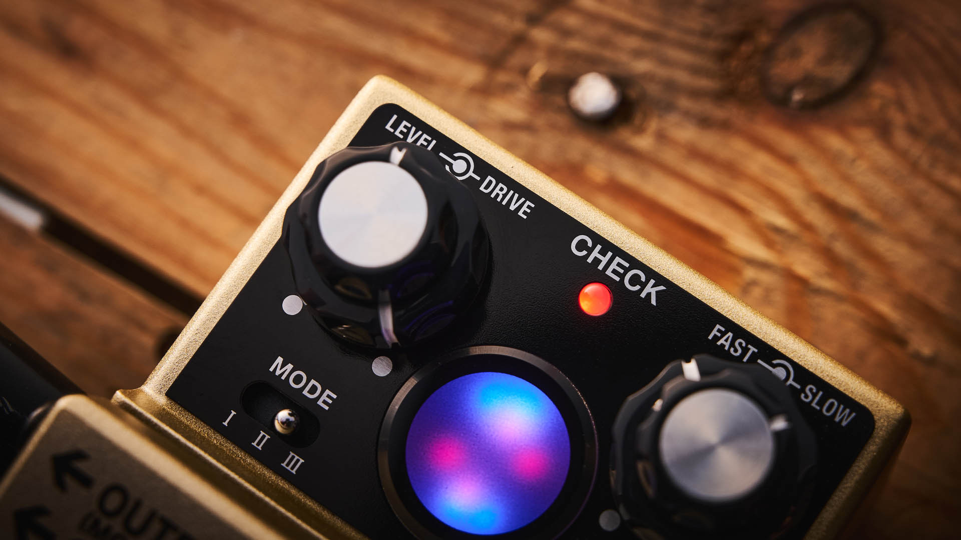 The Boss RT-2 Rotary Ensemble pictured in close-up against a wooden floor.