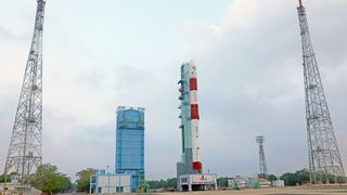 An Indian Space Research Organisation PSLV rocket rolls out to the pad with the Space Docking Experiment satellites aboard. 