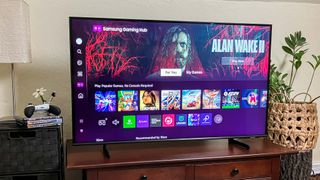 Samsung Q60D QLED TV on console in living room