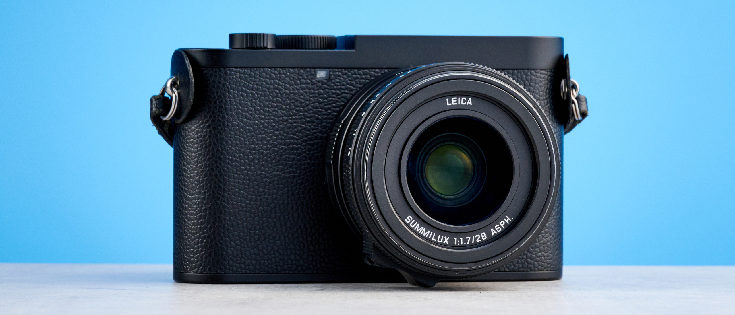A black Leica Q3 Monochrom black-and-white mirrorless camera