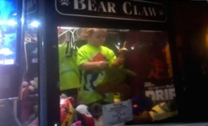 Boy becomes ultimate prize after he crawls inside of a toy claw machine