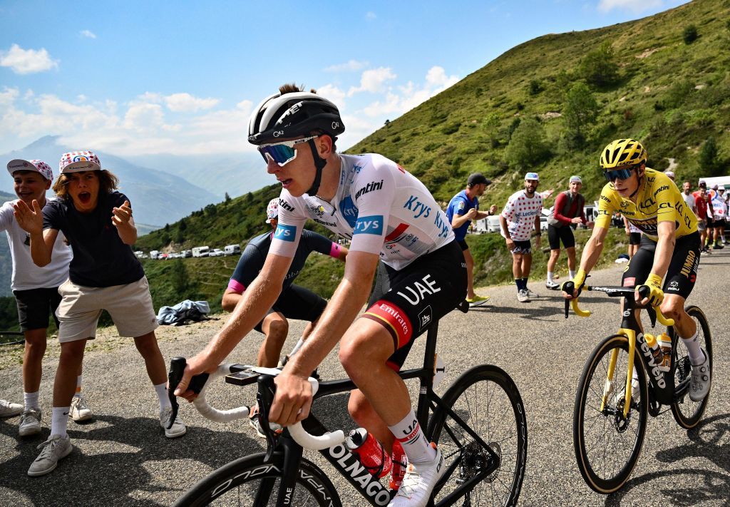 JumboVisma teams Danish rider Jonas Vingegaard R wearing the overall leaders yellow jersey and UAE Team Emirates teams Slovenian rider Tadej Pogacar L wearing the best young riders white jersey cycle in the ascent of Col de Val LouronAzet during the 17th stage of the 109th edition of the Tour de France cycling race 1297 km between SaintGaudens and Peyragudes in southwestern France on July 20 2022 Photo by Marco BERTORELLO AFP Photo by MARCO BERTORELLOAFP via Getty Images