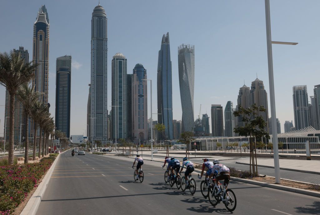 The pack rides during the sixth stage of the UAE Cycling Tour From Dubai Deira Islands to Dubai Palm Jumeriah on February 26 2021 Photo by Giuseppe CACACE AFP Photo by GIUSEPPE CACACEAFP via Getty Images